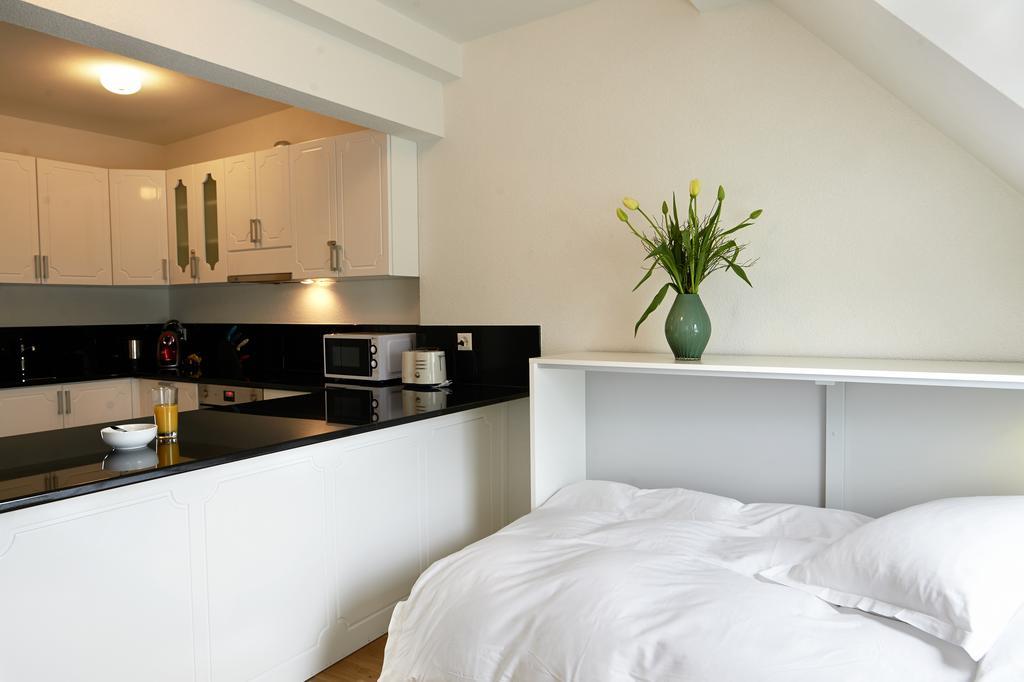Residence Apartments By Hotel Du Commerce Basileia Quarto foto